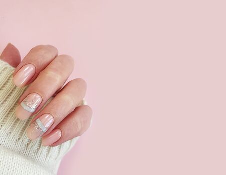 female hand beautiful acrylic manicure nail sweaterの写真素材