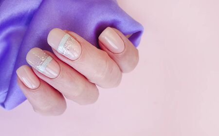 female hand nail beautiful manicure silk stylishの写真素材