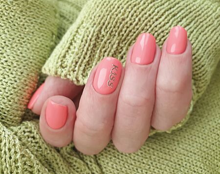 female hand beautiful manicure nail sweater knittedの写真素材