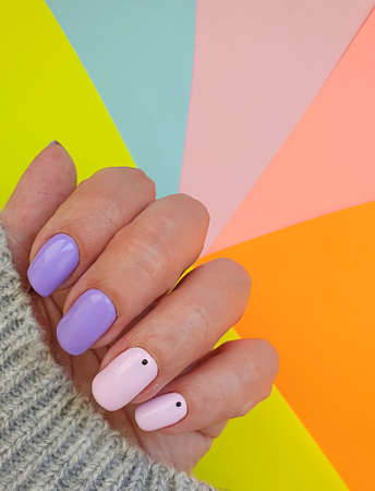 female hand beautiful stylish manicure sweater