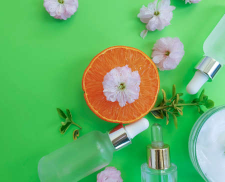 cosmetic cream, flower, orange on a colored backgroundの写真素材