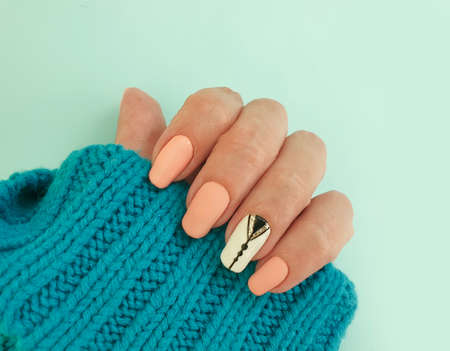 female hand beautiful pink manicure