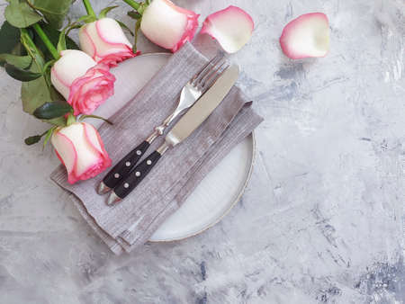 plate flower rose on concrete background