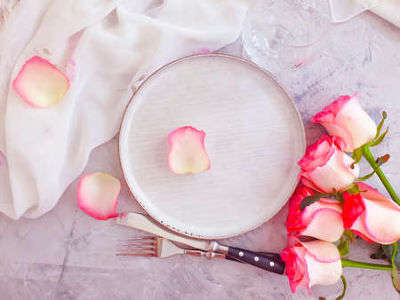 plate flower rose on concrete backgroundの写真素材