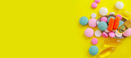vitamins on colored background