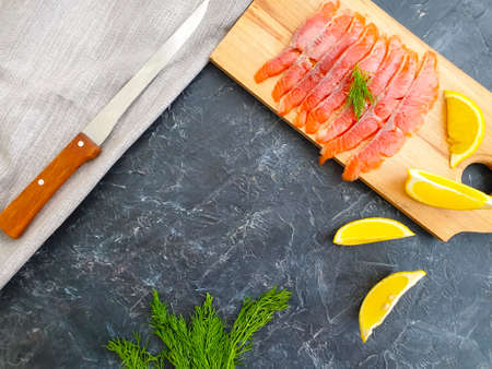 red fish pieces on concrete backgroundの写真素材