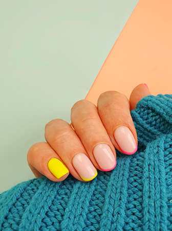 female hand beautiful manicure sweaterの写真素材