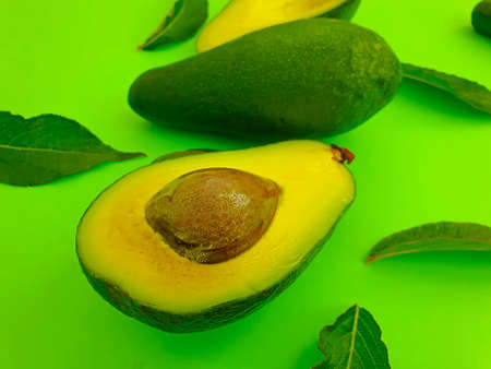 fresh avocado on colored background
