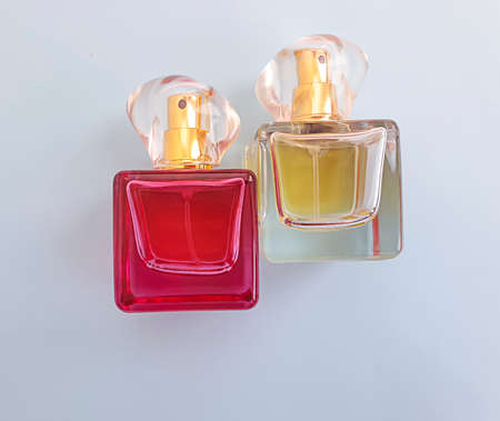 bottle of perfume on a colored backgroundの写真素材