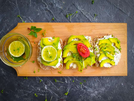 avocado sandwich, tomato on concrete backgroundの写真素材
