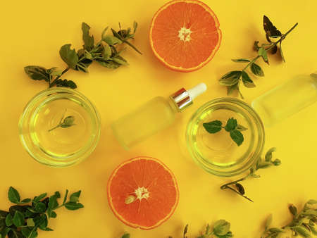 cosmetic cream, oil, orange on a gray backgroundの写真素材