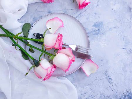 plate flower rose on concrete background