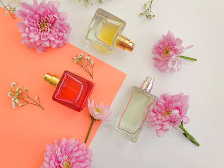 bottle perfume flower on a colored backgroundの写真素材