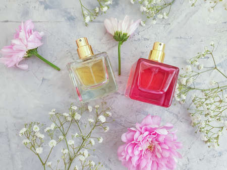 bottle perfume flower on a concrete background