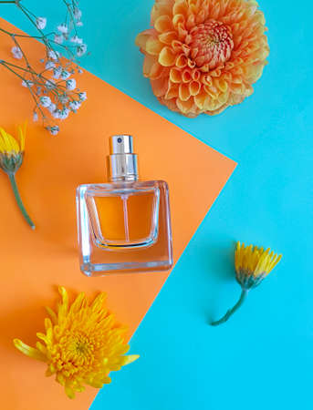 bottle perfume flower on a colored backgroundの写真素材