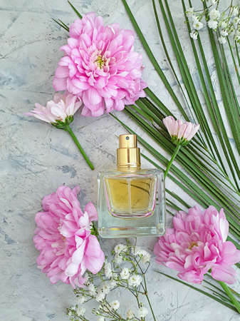 bottle perfume flower on a concrete background
