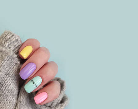 female hand beautiful colored manicureの写真素材