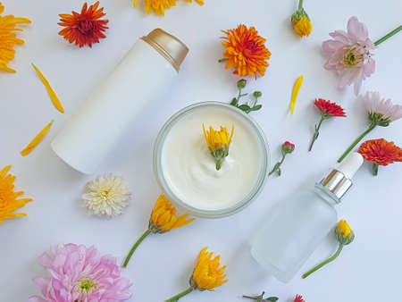 cosmetic cream, flower on a colored backgroundの写真素材