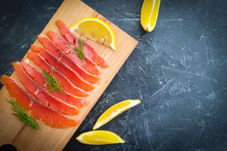 red fish pieces on concrete backgroundの写真素材