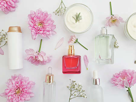 cosmetic cream, flower on a colored backgroundの写真素材