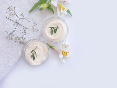 cosmetic cream, flower on a background productの写真素材