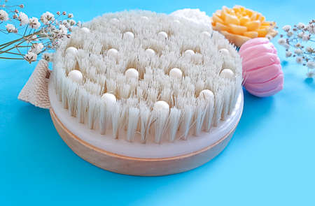 massage brush, soap on a colored backgroundの写真素材