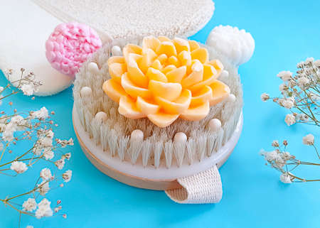 massage brush, soap on a colored backgroundの写真素材