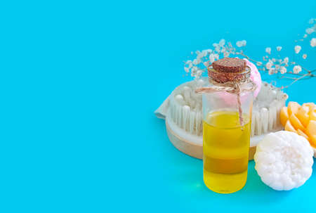 oil cosmetic massage brush on a colored backgroundの写真素材