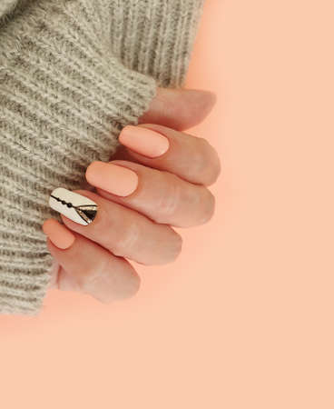 female hand beautiful elegant manicure knitted stylishの写真素材