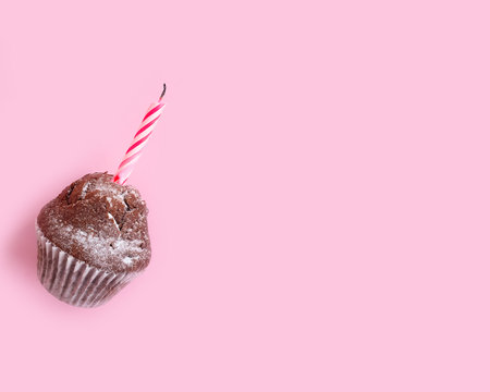 chocolate cake, candle on colored backgroundの写真素材