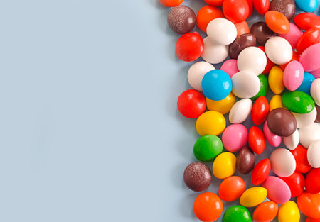 multicolored sweet candies on colored background