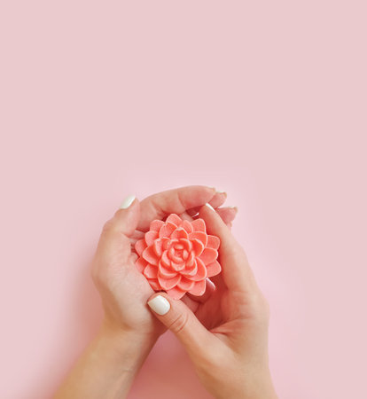 female hands hold natural soapの写真素材