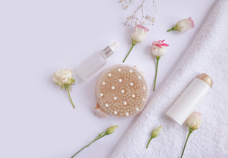 massage brush, flower on a colored backgroundの写真素材