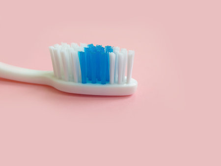 new toothbrush on a colored background
