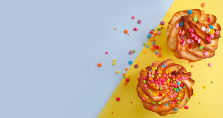 sweet cake on a colored background sprinklesの写真素材