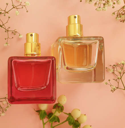 bottle perfume flower on a colored background