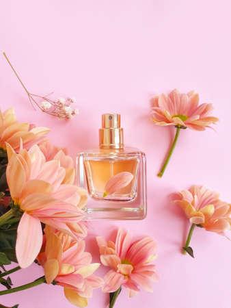 bottle perfume flower on a colored backgroundの写真素材