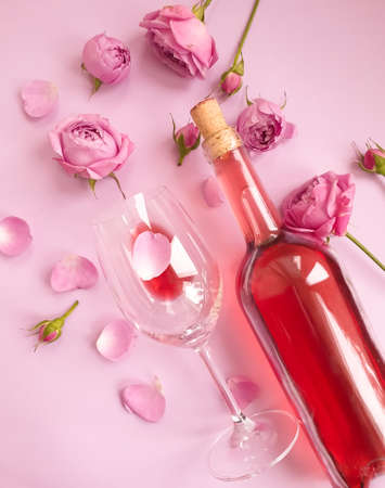 wine glass flower rose on colored backgroundの写真素材