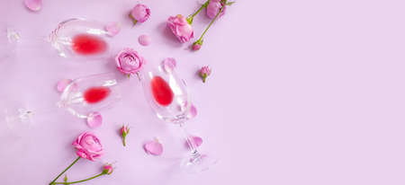 wine glass flower rose on colored backgroundの写真素材
