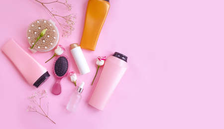 shampoo, comb, flower on a colored backgroundの写真素材