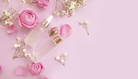 cream cosmetic rose flower on colored backgroundの写真素材