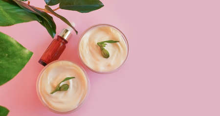cream cosmetic rose flower on colored background