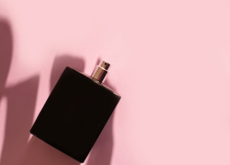 bottle of perfume on a colored backgroundの写真素材