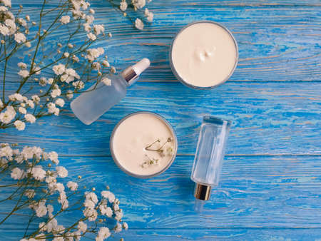 cream cosmetic flower on wooden background