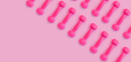 pink dumbbell on colored background