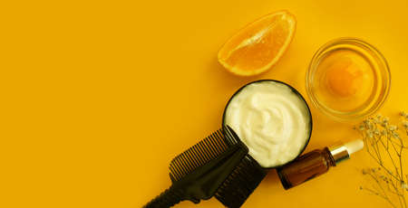 hair mask, comb on a colored background