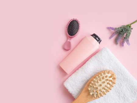 shampoo comb, flower on a colored background