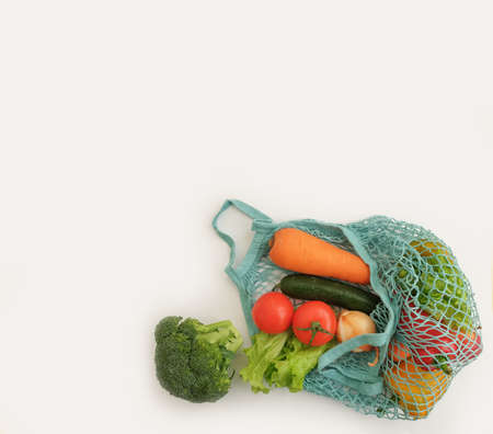 fresh vegetables in eco bag on white backgroundの写真素材