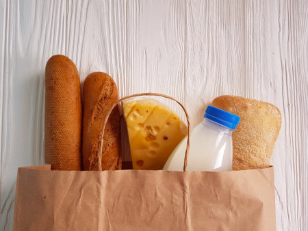 products in a paper bag on a wooden backgroundの写真素材
