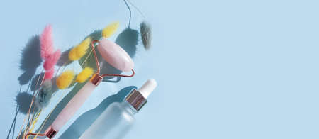 quartz massage roller, gypsophila flower on a colored backgroundの写真素材